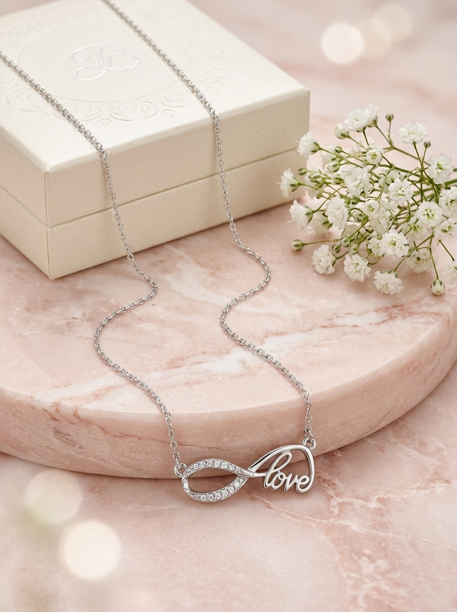 Eternal Bond: Silver-tone Cursive "Love" Infinity Rhinestone Pendant  Necklace