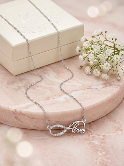 Eternal Bond: Silver-tone Cursive "Love" Infinity Rhinestone Pendant  Necklace